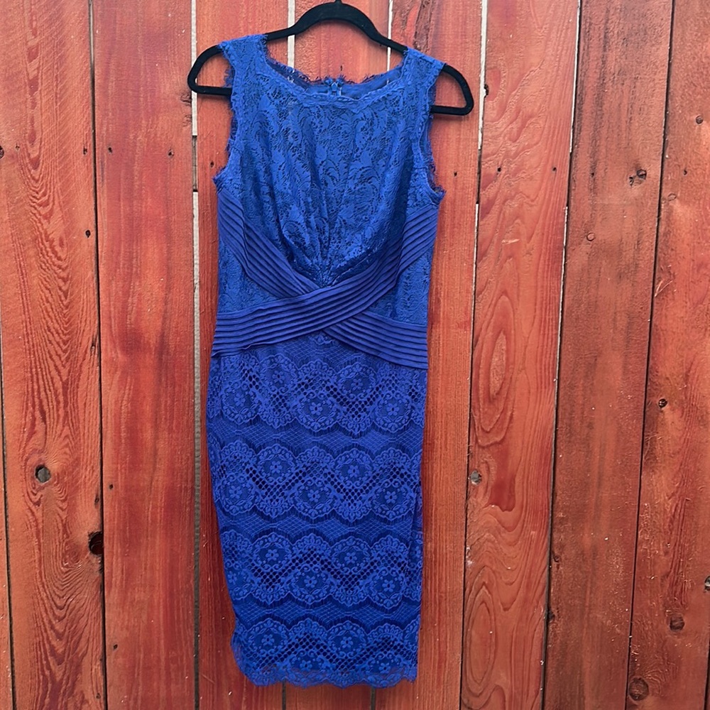 Lace dress with back zipper. Size 6 , been worn , good condition.